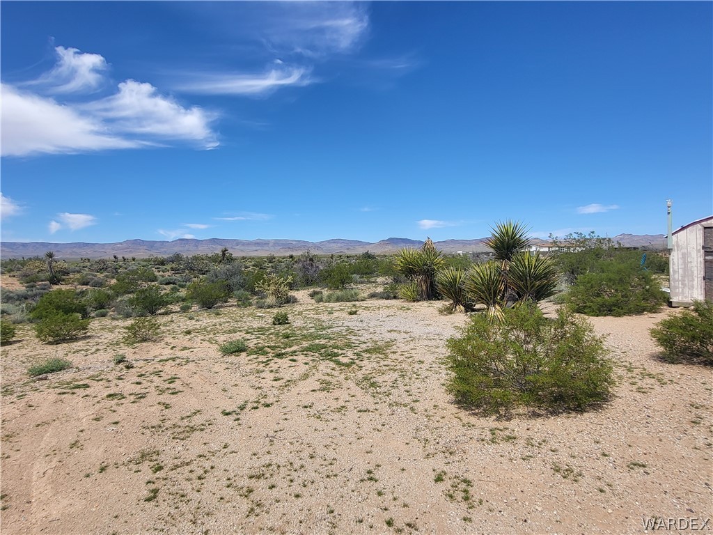 5397 Cordes Road Golden Valley, AZ 86413 - Photo 24 of 50 a view of a lake with beach and background