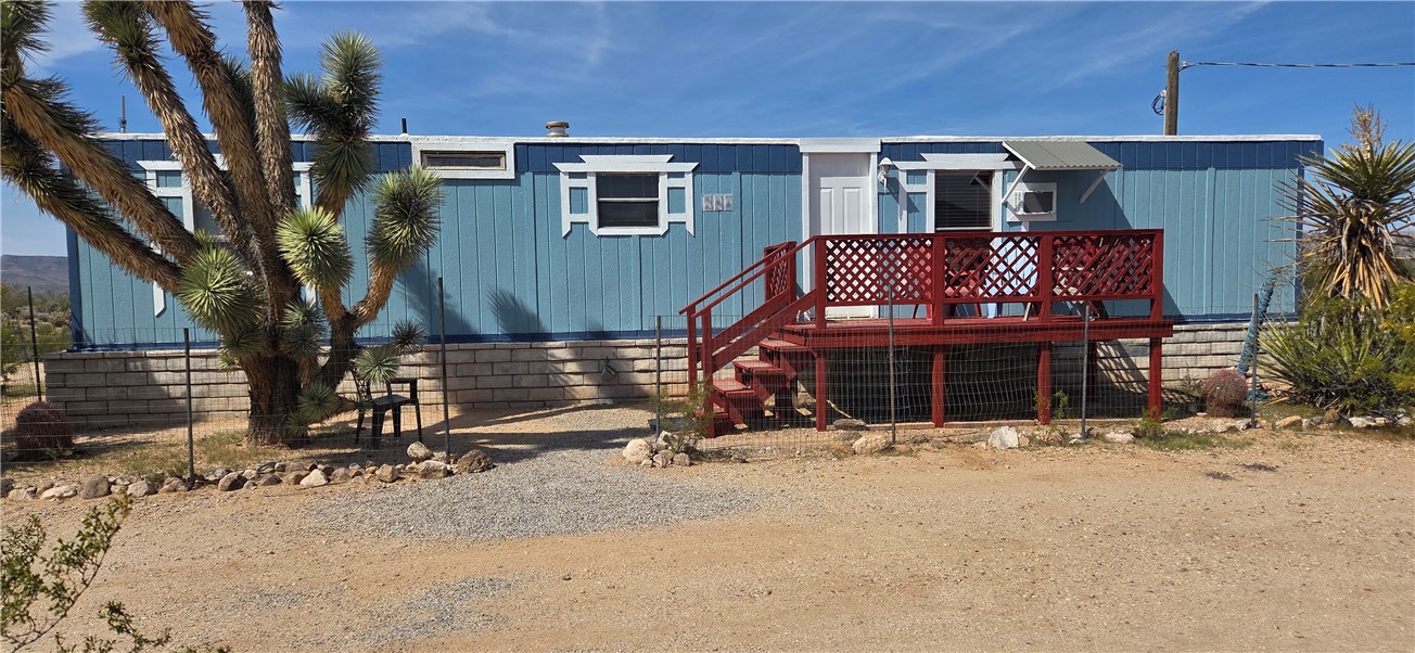 5397 Cordes Road Golden Valley, AZ 86413 - Photo 30 of 50 a view of a house with wooden fence
