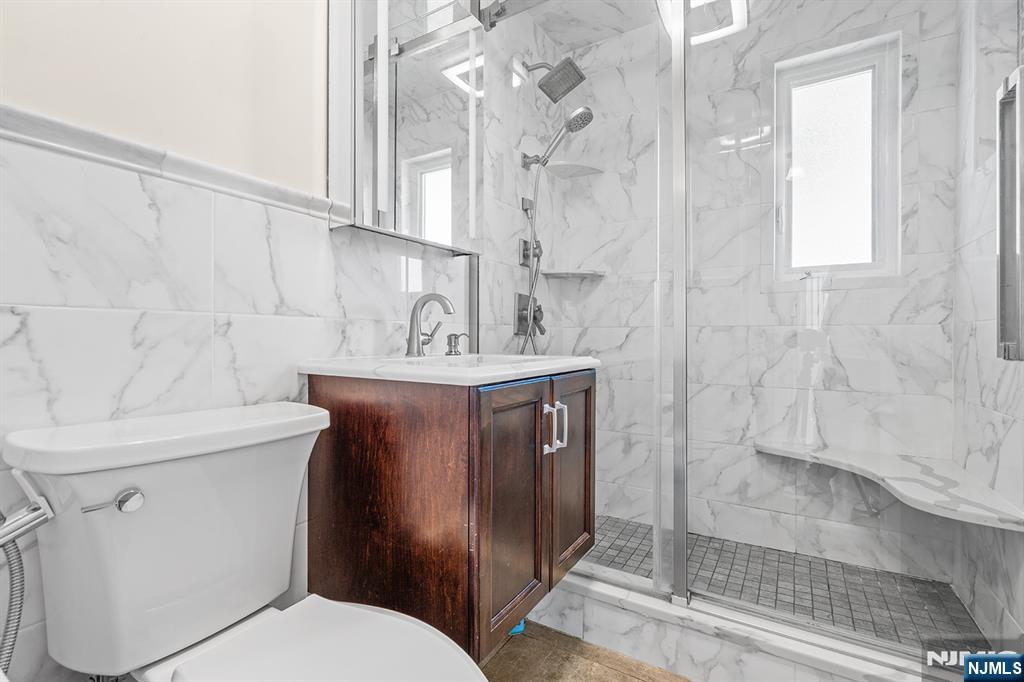 71 Wingra Avenue Rutherford, NJ 07070 - Photo 10 of 20 a bathroom with a sink toilet and shower