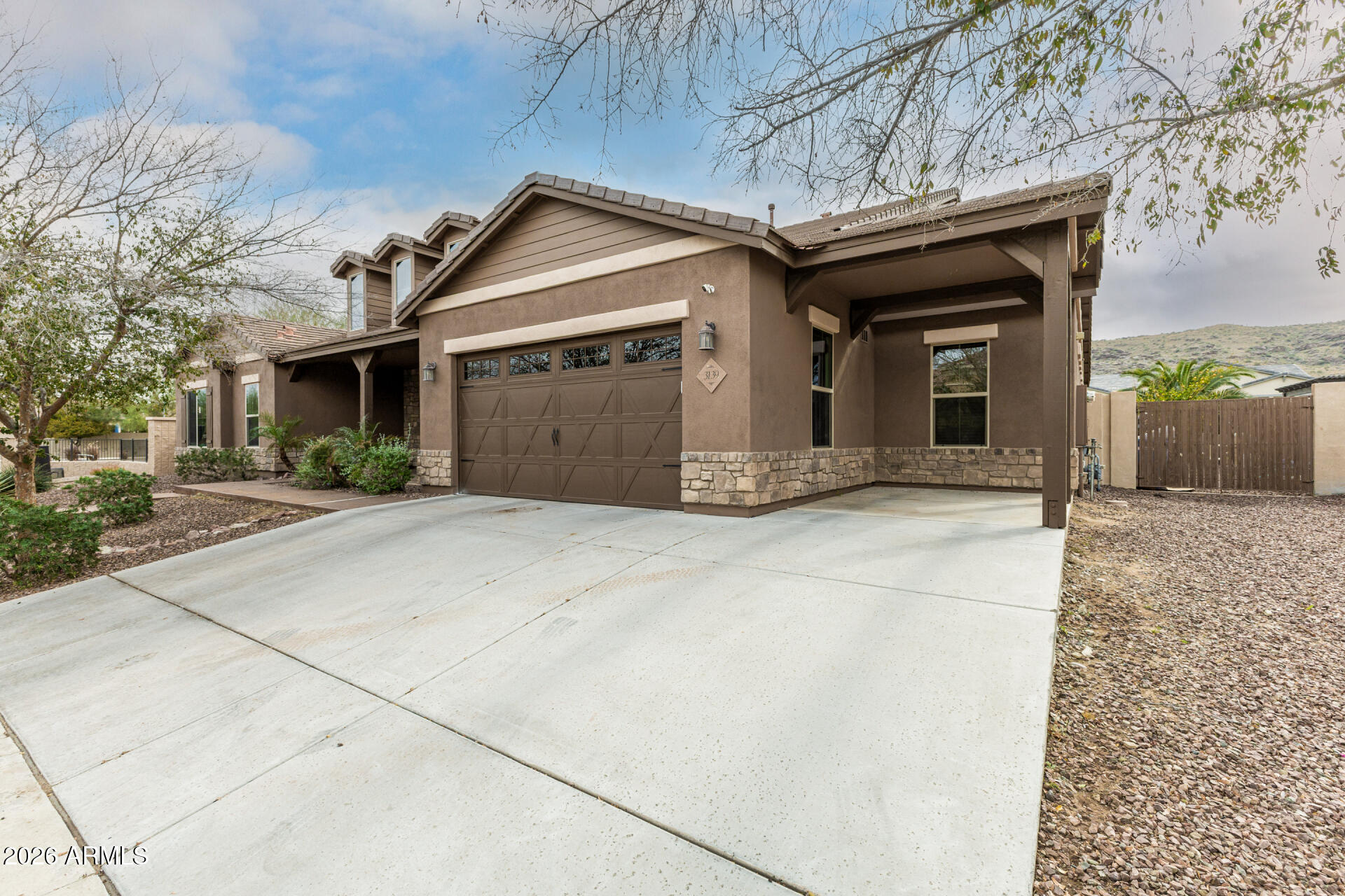 3139 East Harwell Road Phoenix, AZ 85042 - Photo 2 of 45 a front view of a house with a yard
