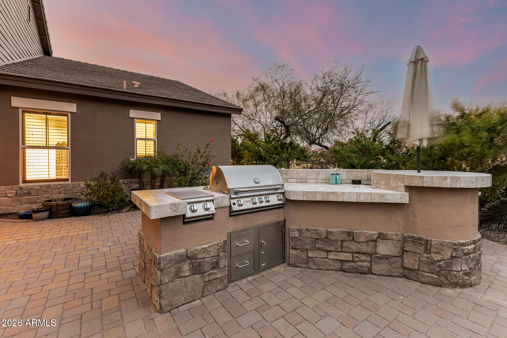 3139 East Harwell Road Phoenix, AZ 85042 - Photo 35 of 45 a view of a patio with table and chairs with wooden fence