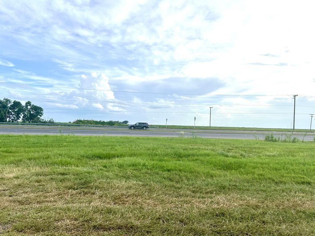 a view of an ocean and a yard