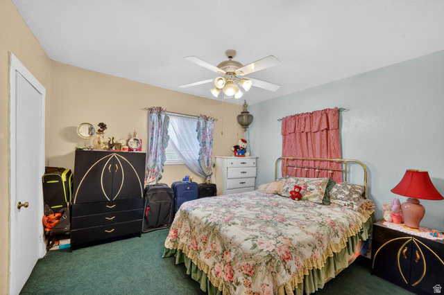 977 23rd Street Ogden, UT 84401 - Photo 12 of 29 Bedroom with dark colored carpet and ceiling fan