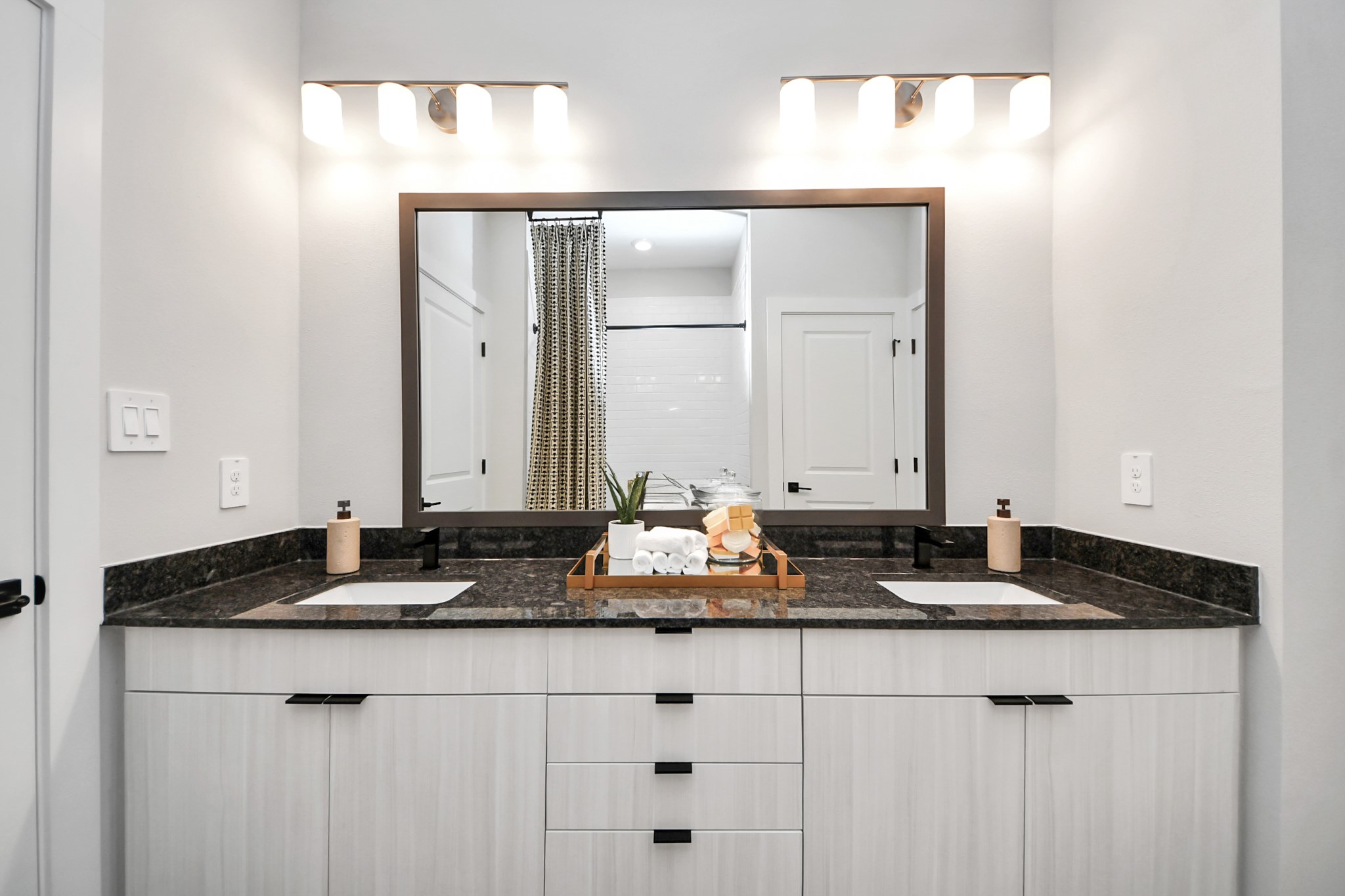 7711 Longmire Road, Unit 2 Conroe, TX 77304 - Photo 15 of 48 Primary Suite offers walk-closet,bath w/dual vanities&lux tub/shower.