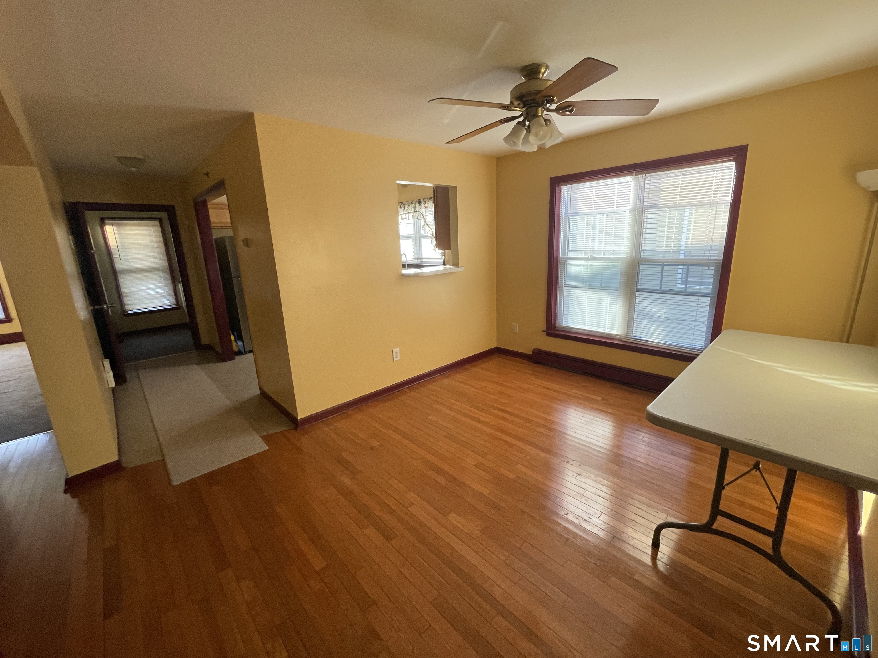 11 Button Street New Haven, CT 06519 - Photo 12 of 18 a view of a livingroom with furniture hardwood floor and a ceiling fan