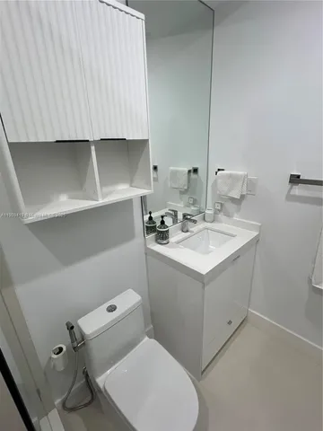 a utility room with sink dryer and washer