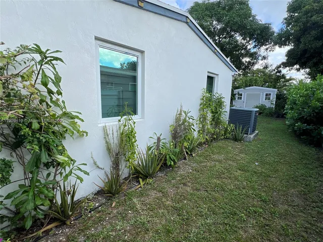 a backyard of a house with lots of green space