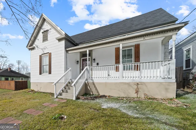 a view of a house with a house in the background