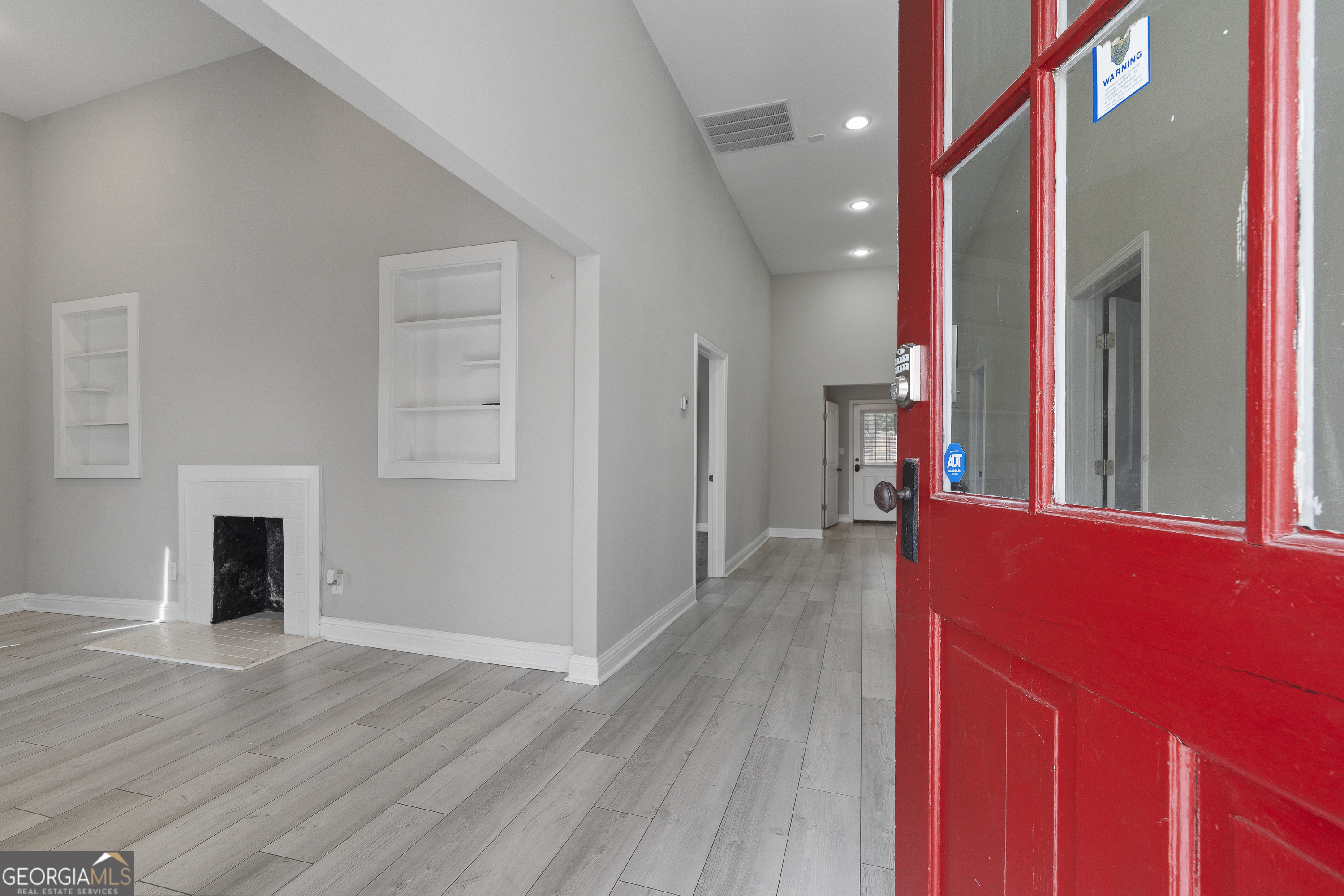 1471 Jackson Street Macon, GA 31201 - Photo 5 of 30 a view of a hallway with wooden floor and staircase