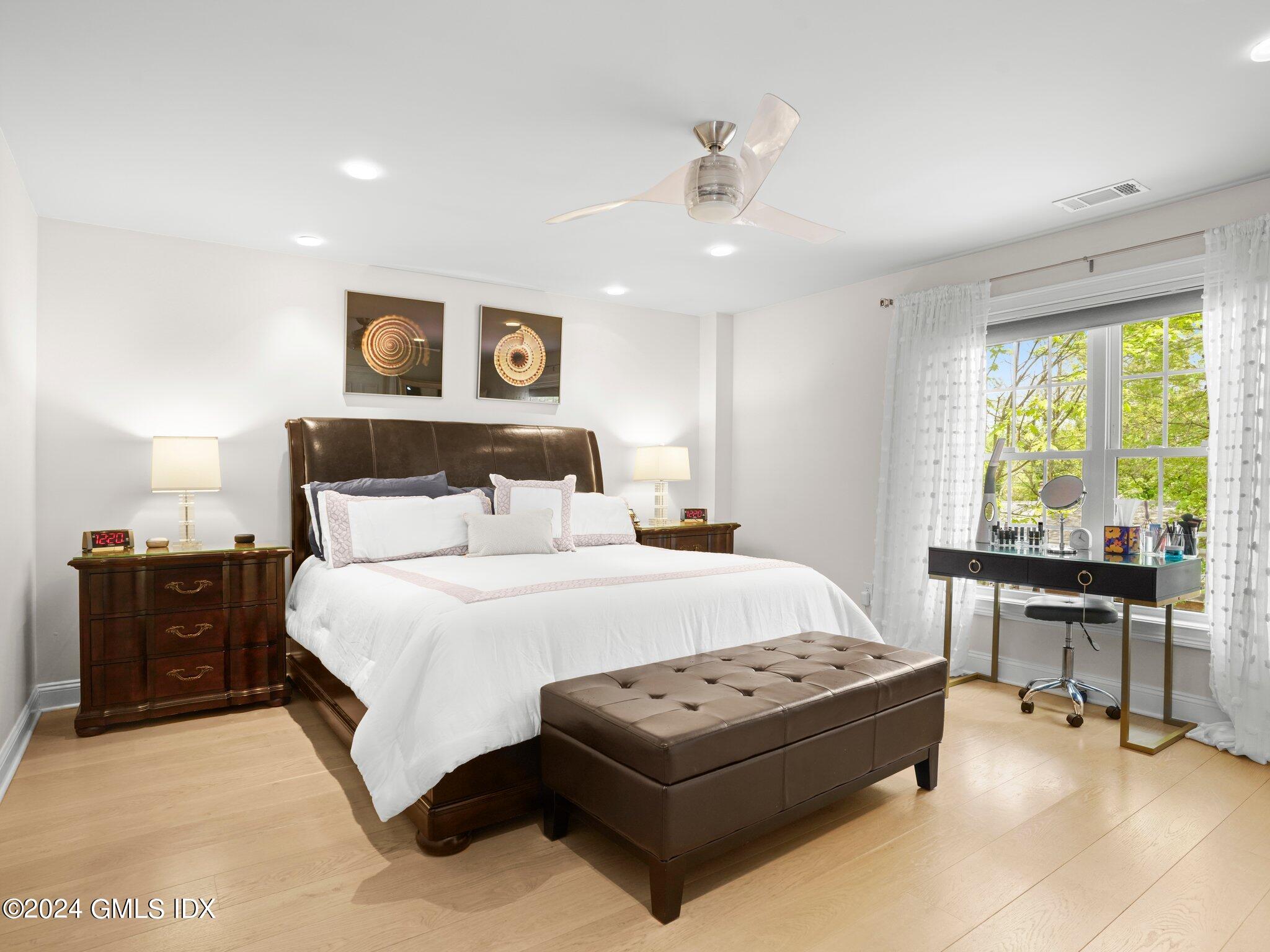 32 Cliff Avenue, Unit 3 Greenwich, CT 06830 - Photo 11 of 23 a bedroom with a bed and a table in it