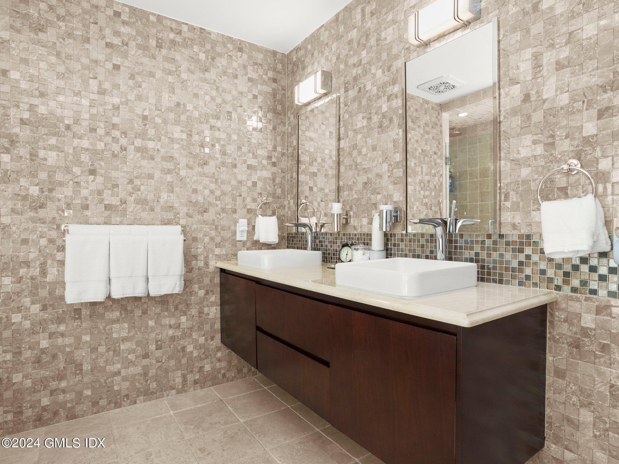 32 Cliff Avenue, Unit 3 Greenwich, CT 06830 - Photo 13 of 23 a bathroom with a sink and a mirror