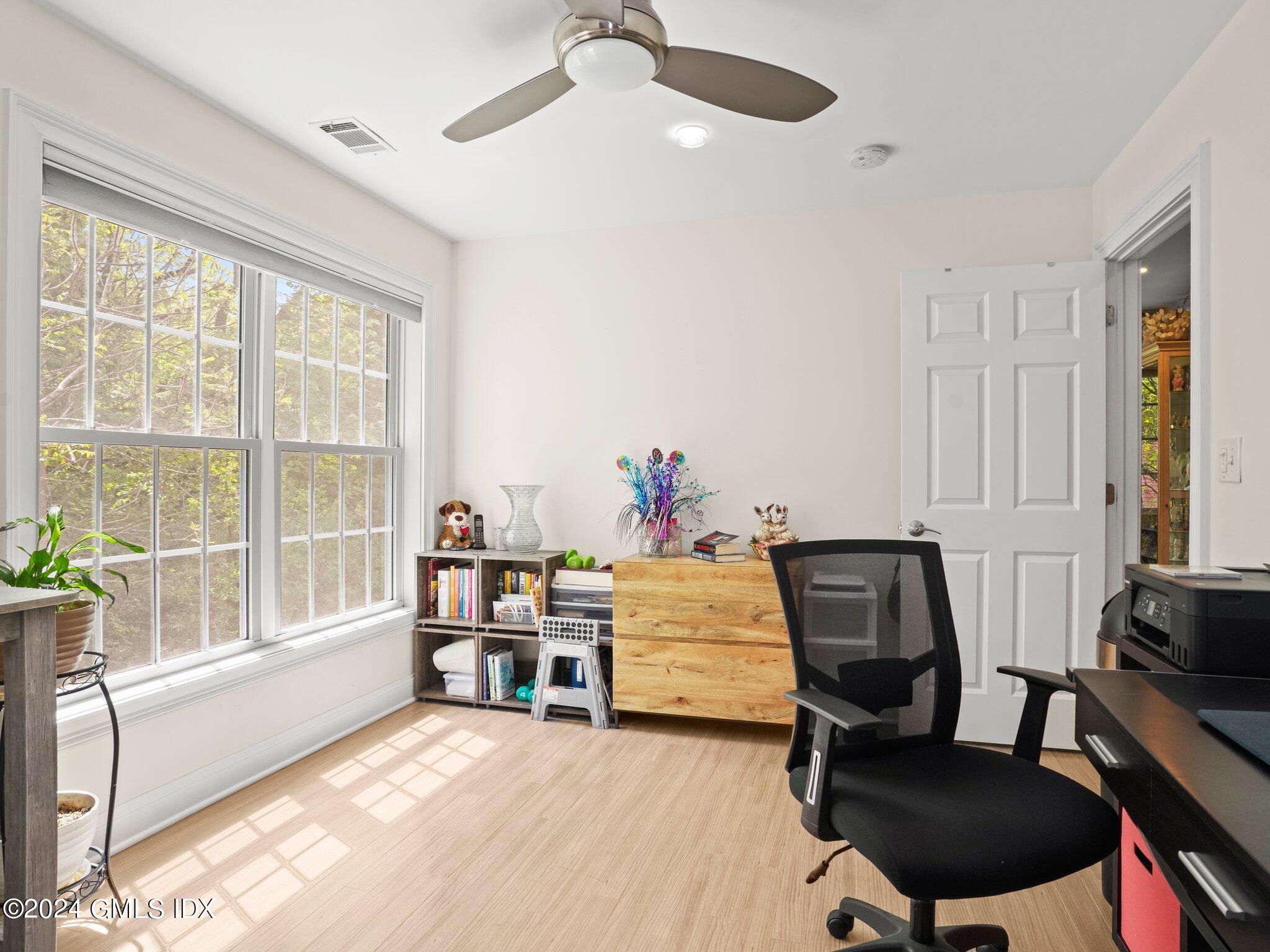 32 Cliff Avenue, Unit 3 Greenwich, CT 06830 - Photo 14 of 23 a view of a workspace with furniture and a window