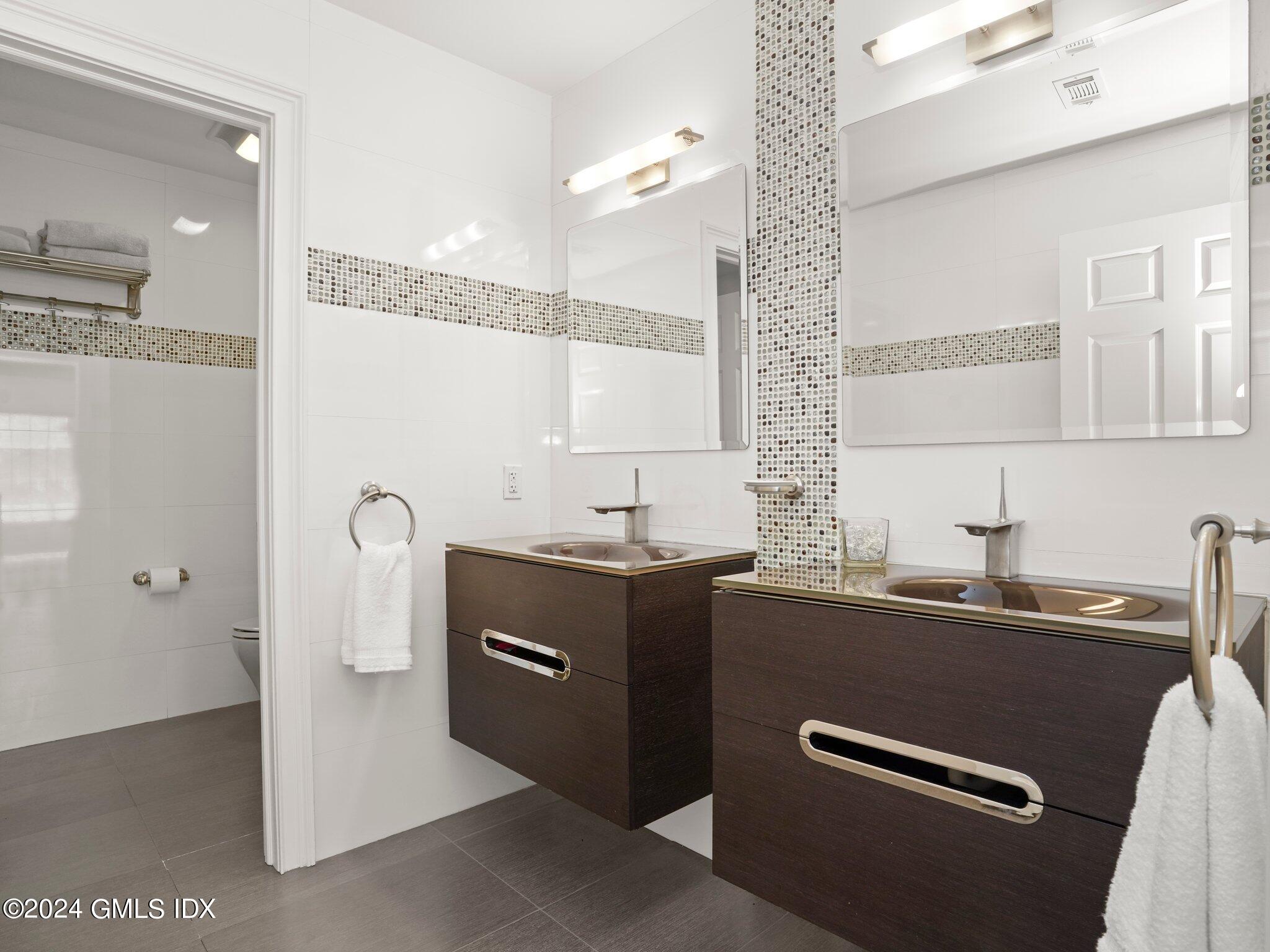 32 Cliff Avenue, Unit 3 Greenwich, CT 06830 - Photo 16 of 23 a view of a kitchen with a sink and dishwasher