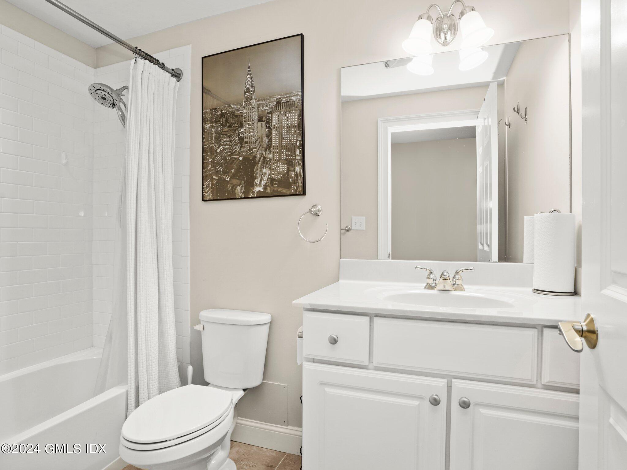 32 Cliff Avenue, Unit 3 Greenwich, CT 06830 - Photo 18 of 23 a bathroom with a sink a toilet and shower