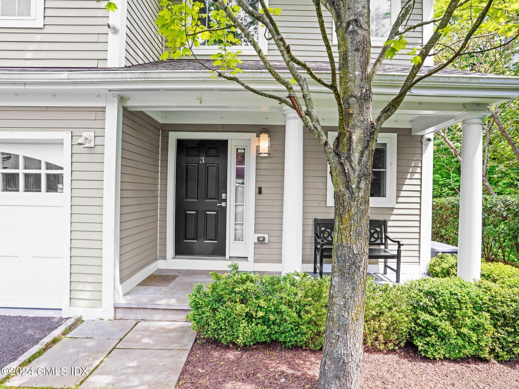32 Cliff Avenue, Unit 3 Greenwich, CT 06830 - Photo 2 of 23 a front view of a house with garden