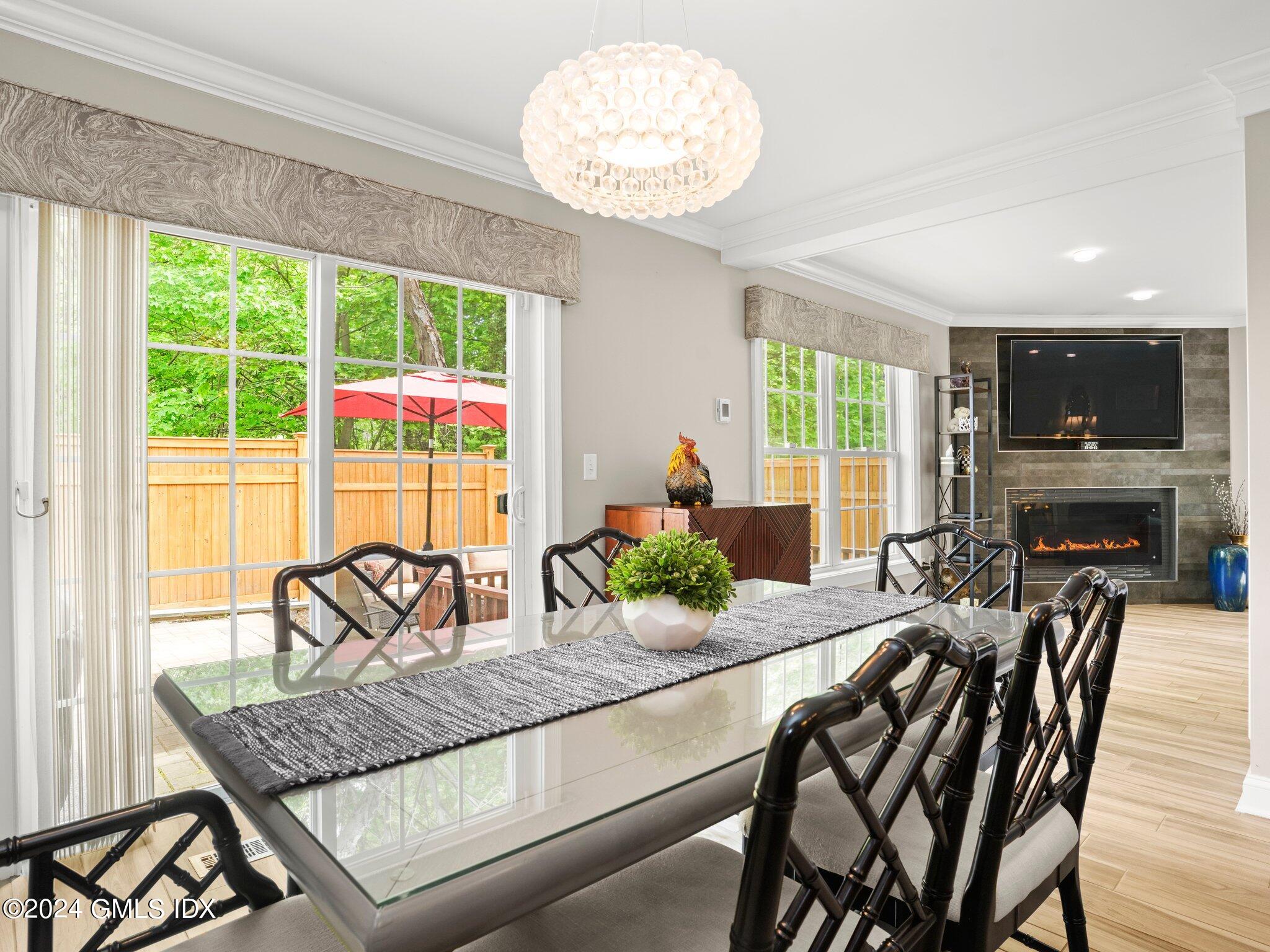 32 Cliff Avenue, Unit 3 Greenwich, CT 06830 - Photo 8 of 23 a view of a dining room with furniture window and outside view