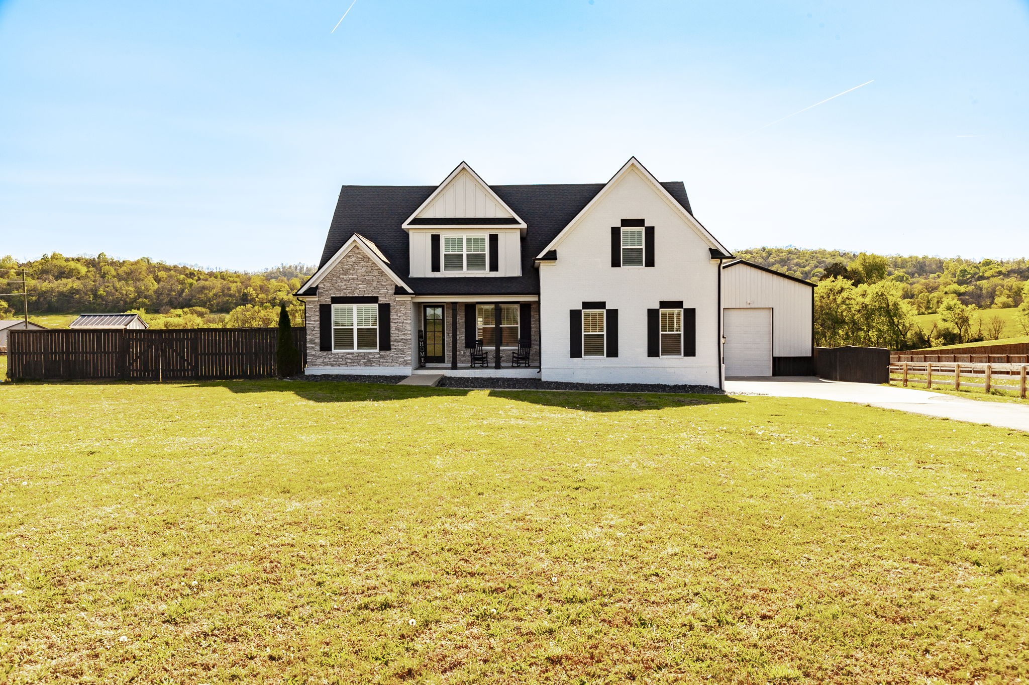 1160 Hearn Hill Road Watertown, TN 37184 - Photo 5 of 91 a front view of a house with a large pool