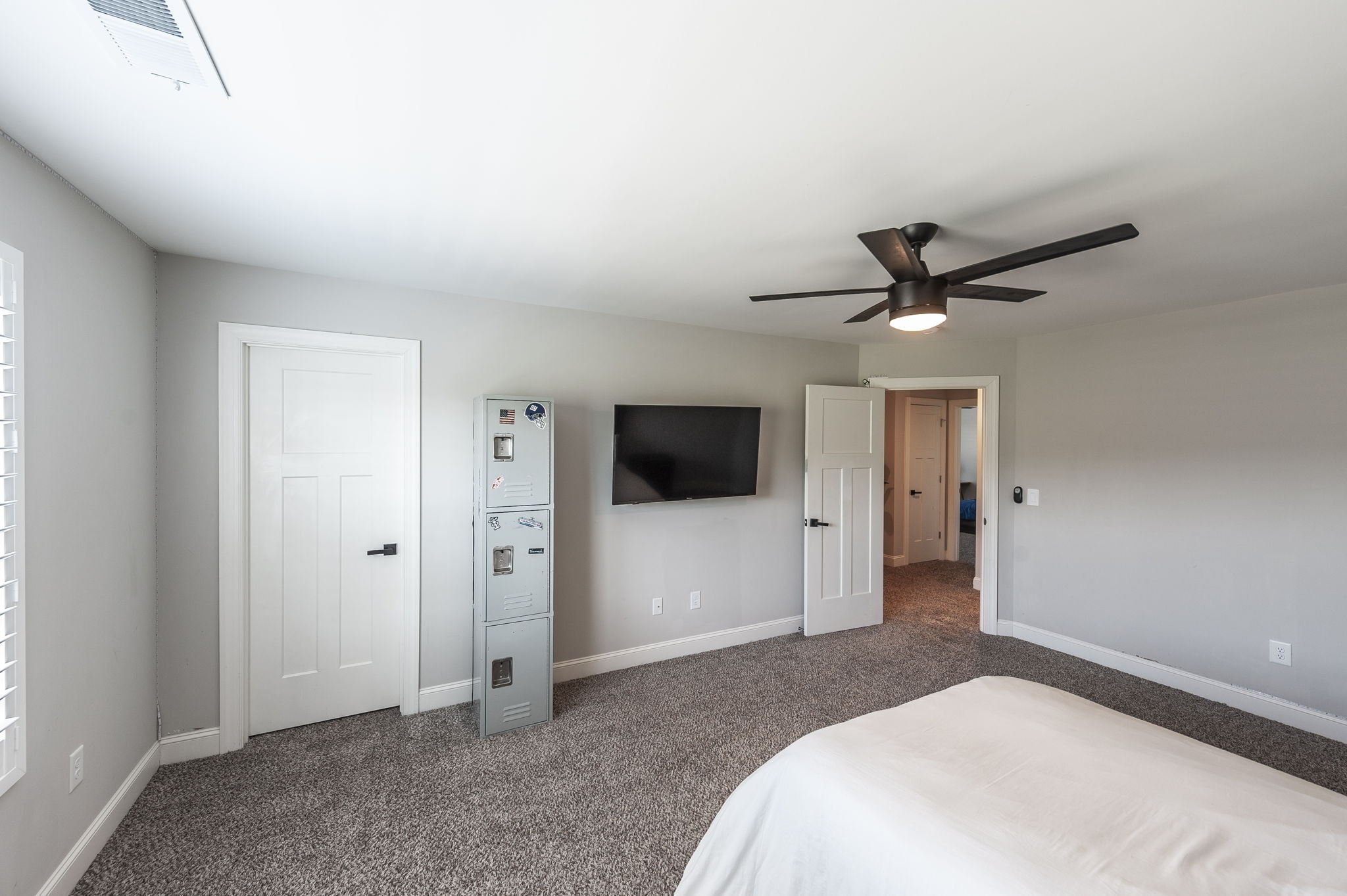 1160 Hearn Hill Road Watertown, TN 37184 - Photo 51 of 91 a bedroom with a large bed and a flat screen tv
