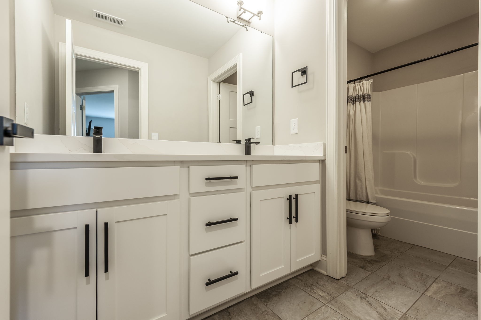 1160 Hearn Hill Road Watertown, TN 37184 - Photo 55 of 91 a bathroom with a sink a toilet a mirror and shower