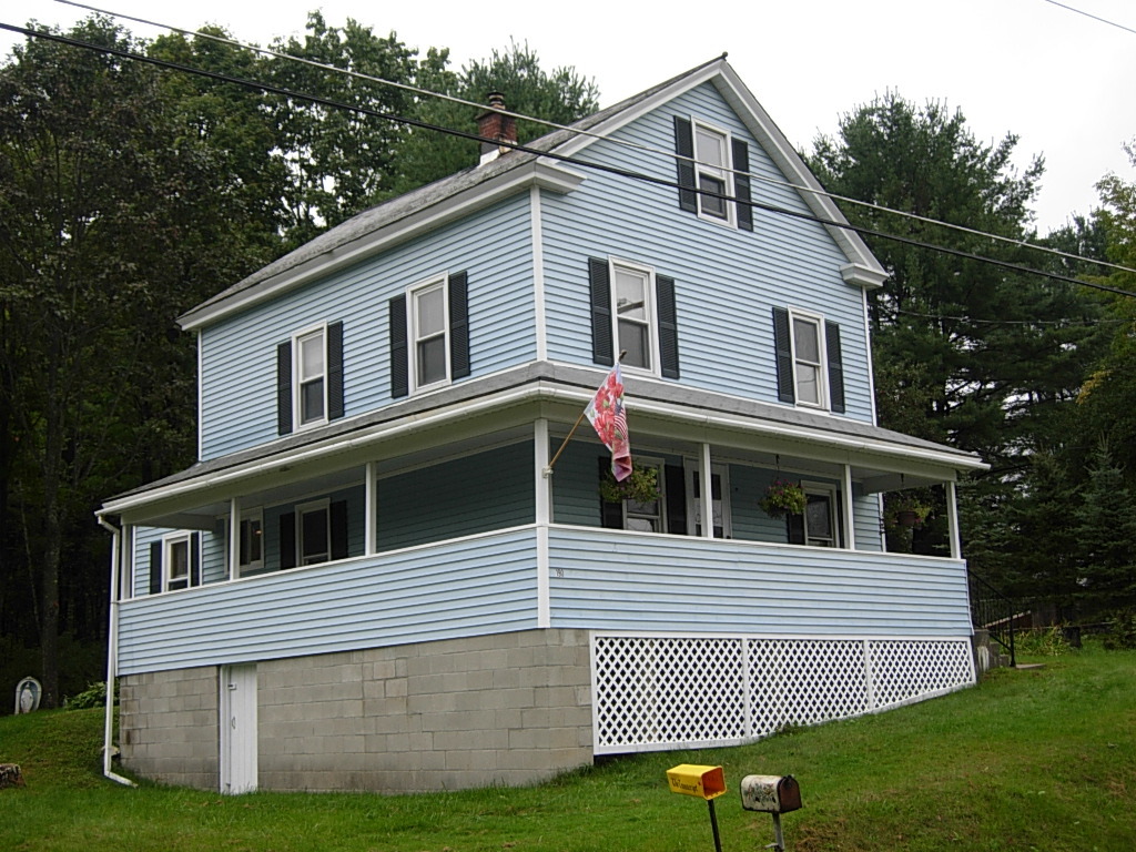 190 Cross Road Clarksburg, MA 01247 - Photo 1 of 12 a front view of a house with a yard and garage