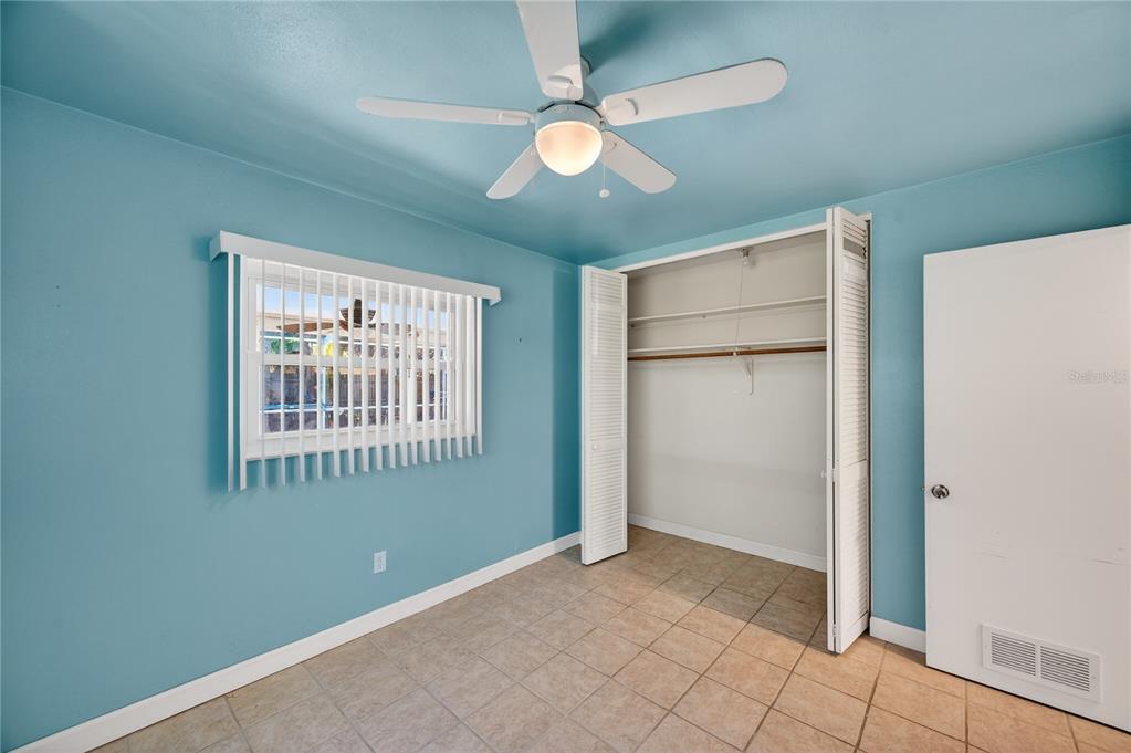 1417 Spring Lane Clearwater, FL 33755 - Photo 14 of 28 an empty room with closet and windows
