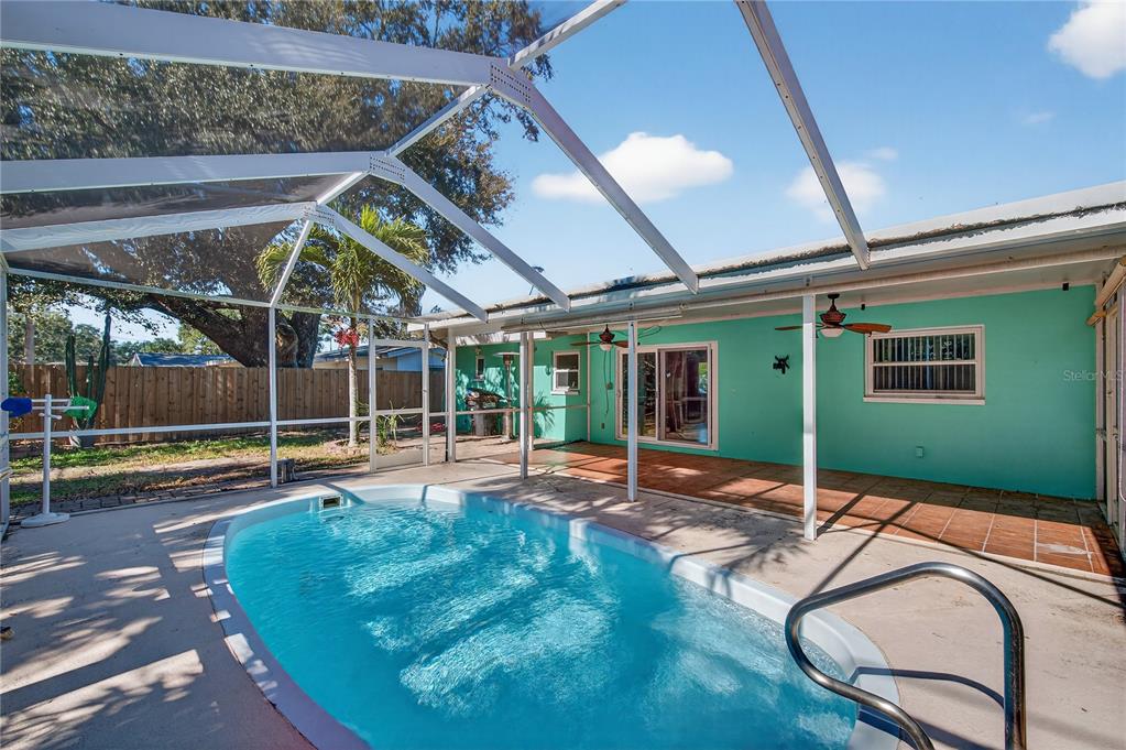 1417 Spring Lane Clearwater, FL 33755 - Photo 24 of 29 a view of a swimming pool with a patio