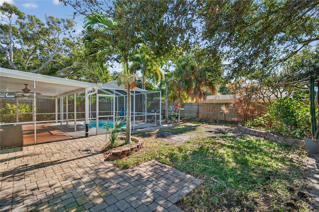 1417 Spring Lane Clearwater, FL 33755 - Photo 25 of 28 a view of a house with backyard and sitting area