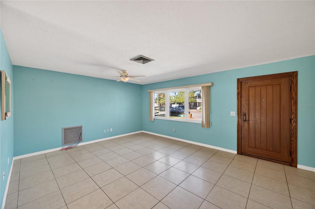 1417 Spring Lane Clearwater, FL 33755 - Photo 5 of 29 a bedroom with a bed and a window