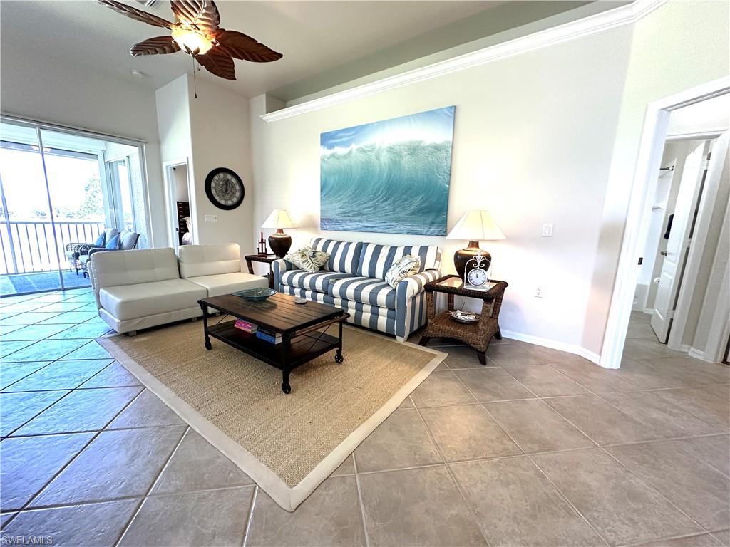 1965 Crestview Way, Unit 156 Naples, FL 34119 - Photo 18 of 45 a living room with furniture and a large window