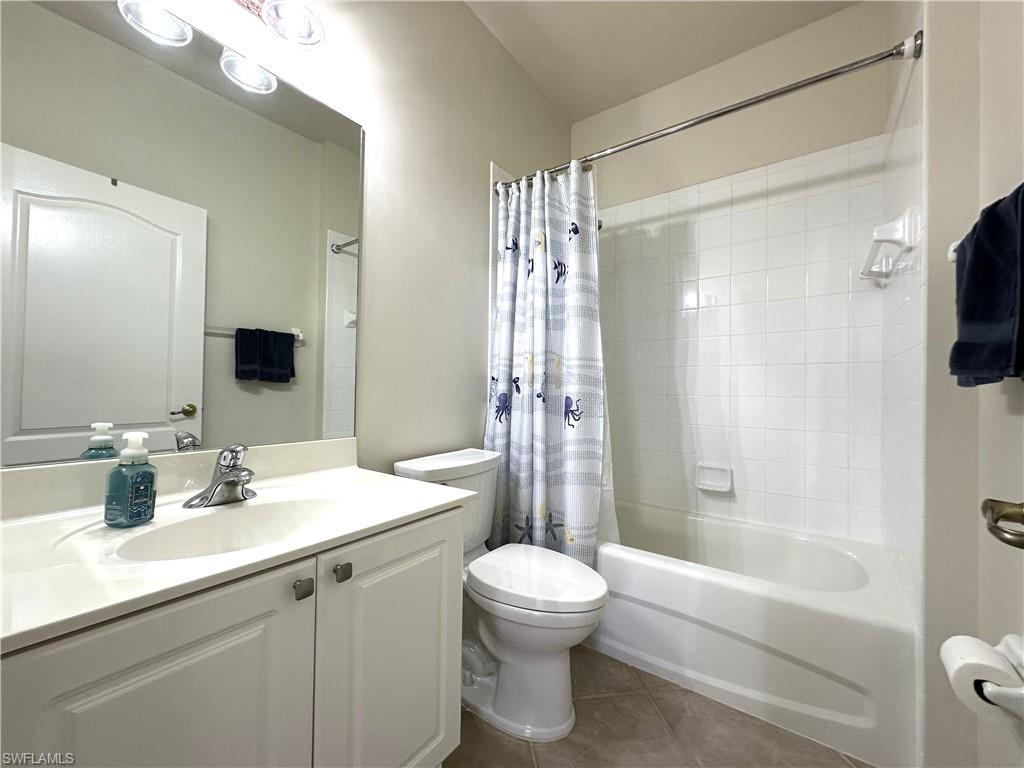 1965 Crestview Way, Unit 156 Naples, FL 34119 - Photo 21 of 45 a bathroom with a sink a toilet and shower