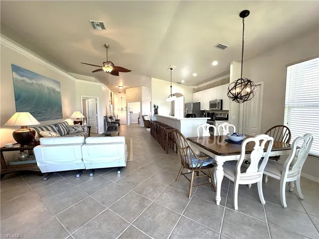 a large room with a lot of white furniture