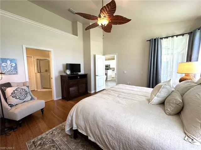 a spacious bathroom with a double vanity sink mirror and shower