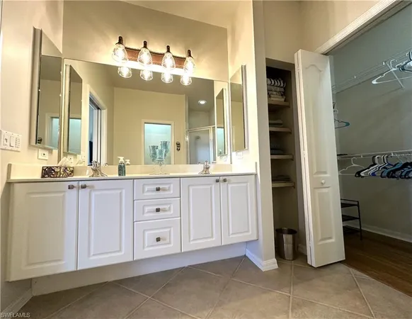 a bathroom with a granite countertop shower and a toilet