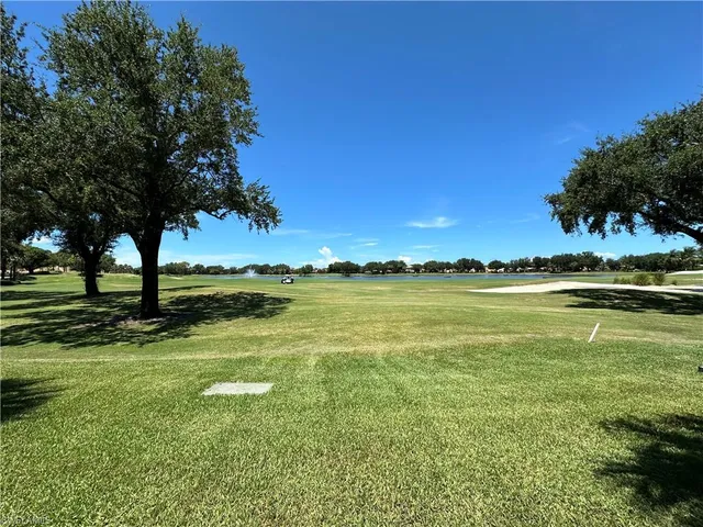 a view of the house with a yard