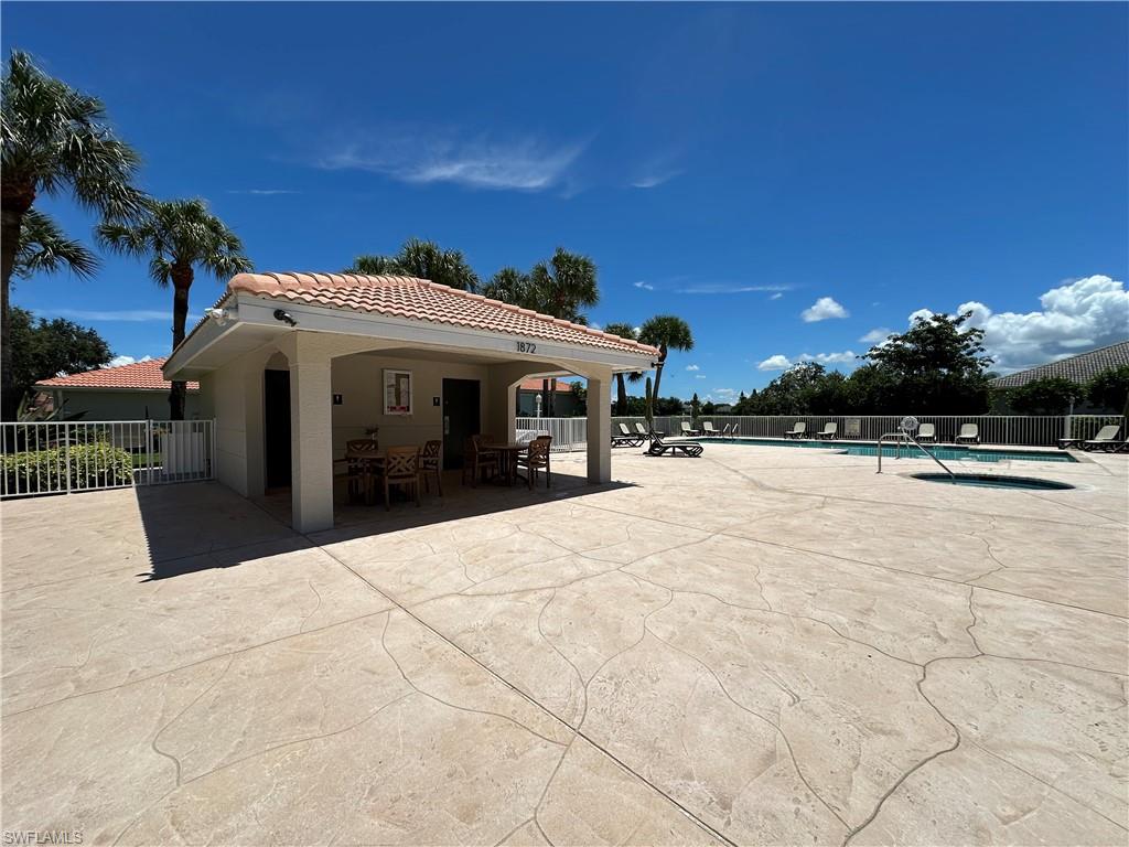1965 Crestview Way, Unit 156 Naples, FL 34119 - Photo 35 of 45 a view of the house with a yard