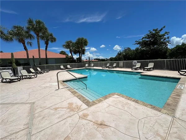 a view of a swimming pool with a patio