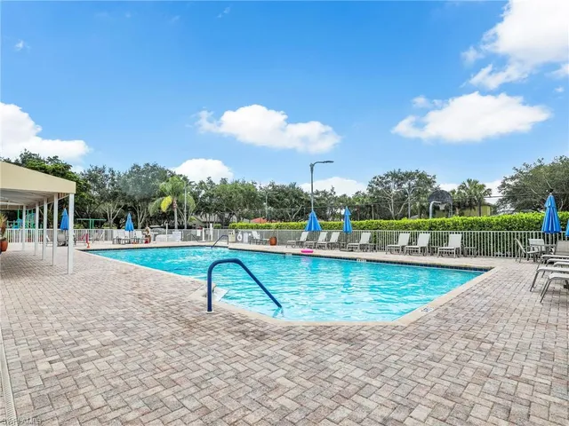 an aerial view of a house with yard swimming pool and outdoor seating