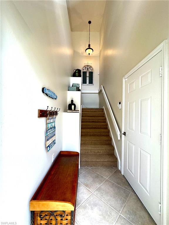 1965 Crestview Way, Unit 156 Naples, FL 34119 - Photo 4 of 45 a view of a hallway with furniture and entryway