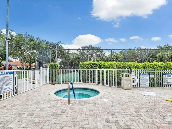 a view of a house with a swimming pool and a yard