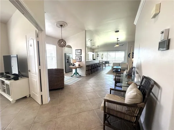 a living room with couches and flat screen tv