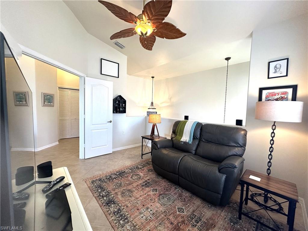 1965 Crestview Way, Unit 156 Naples, FL 34119 - Photo 10 of 45 a living room with furniture and wooden floor