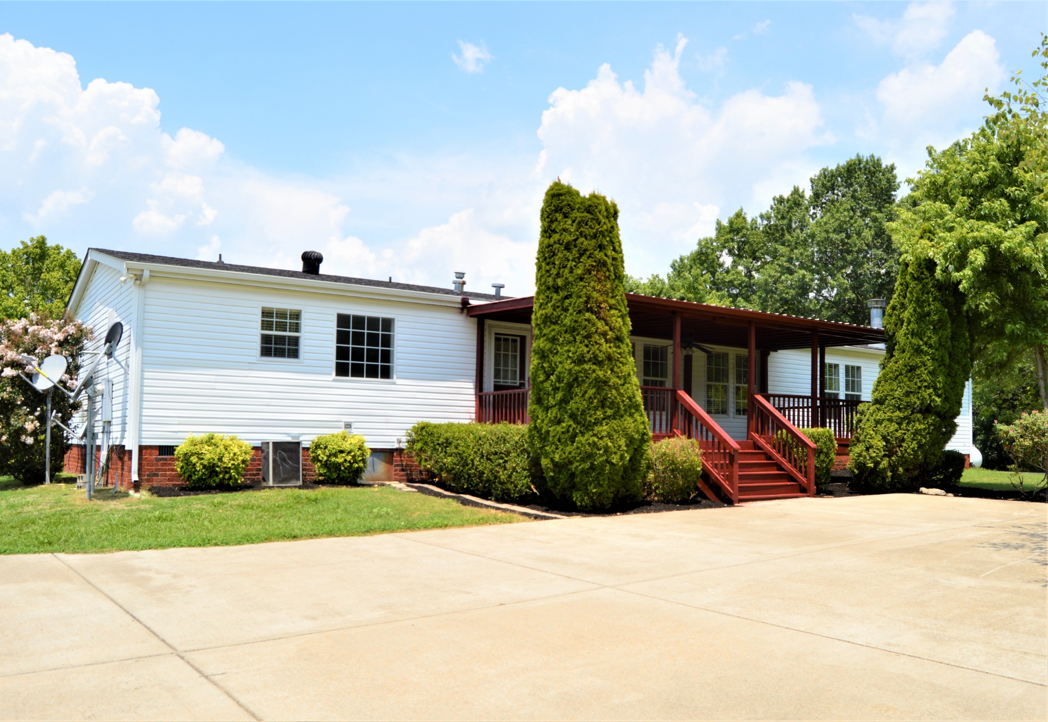 545 East Robertson Road Castalian Springs, TN 37031 - Photo 4 of 19 a front view of a house with a yard and potted plants