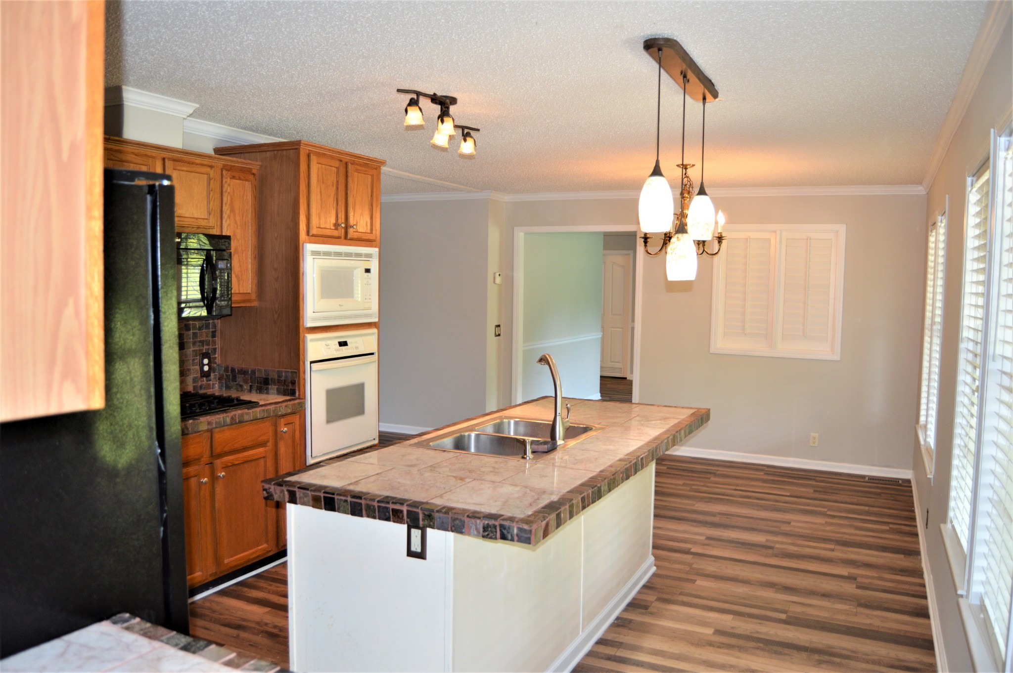 545 East Robertson Road Castalian Springs, TN 37031 - Photo 7 of 19 a kitchen with stainless steel appliances granite countertop a sink and refrigerator