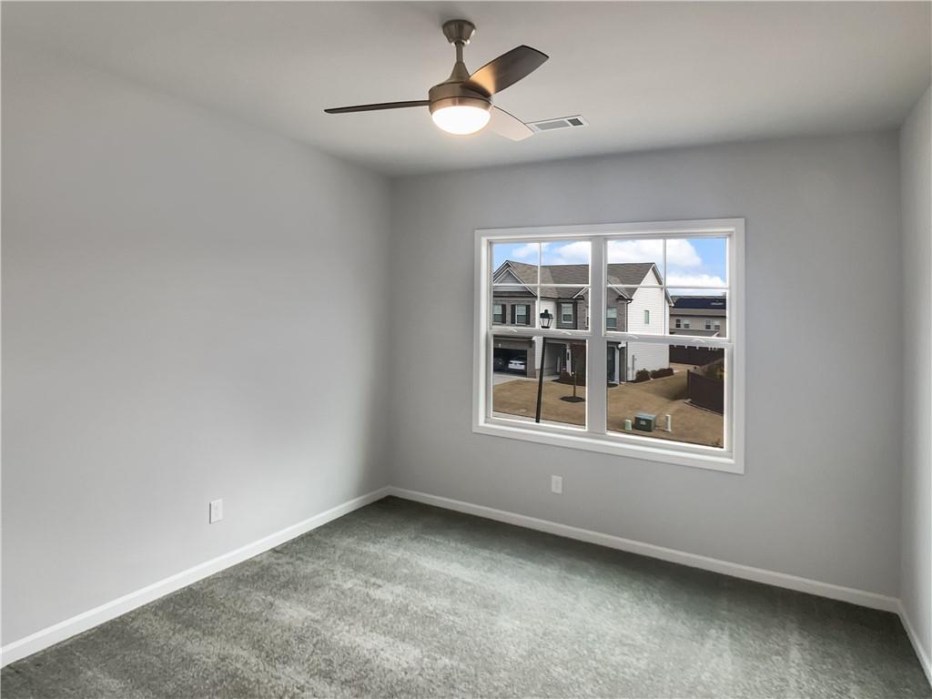908 West Union Grove Circle Auburn, GA 30011 - Photo 11 of 16 an empty room with a window