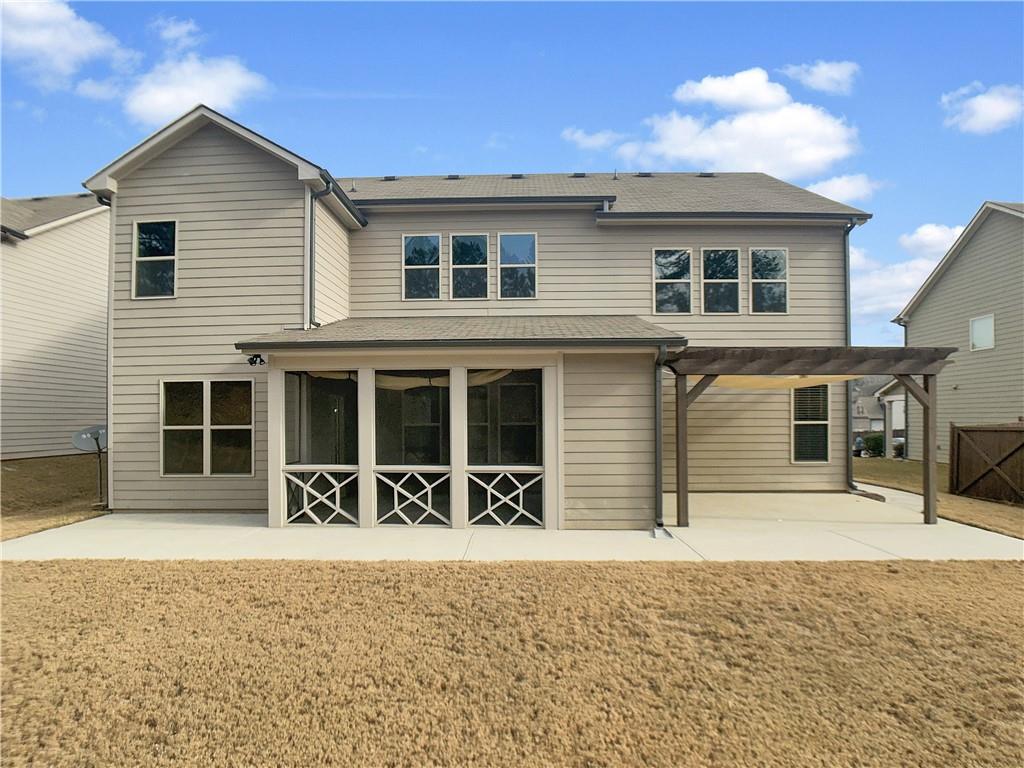 908 West Union Grove Circle Auburn, GA 30011 - Photo 15 of 16 a front view of a house with a yard