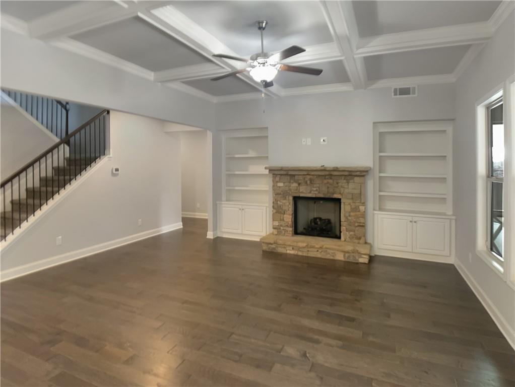 908 West Union Grove Circle Auburn, GA 30011 - Photo 3 of 16 a view of an empty room with a fireplace and a window