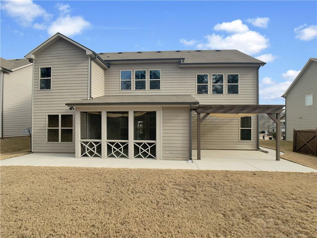 908 West Union Grove Circle Auburn, GA 30011 - Photo 5 of 16 a front view of a house with yard and seating space
