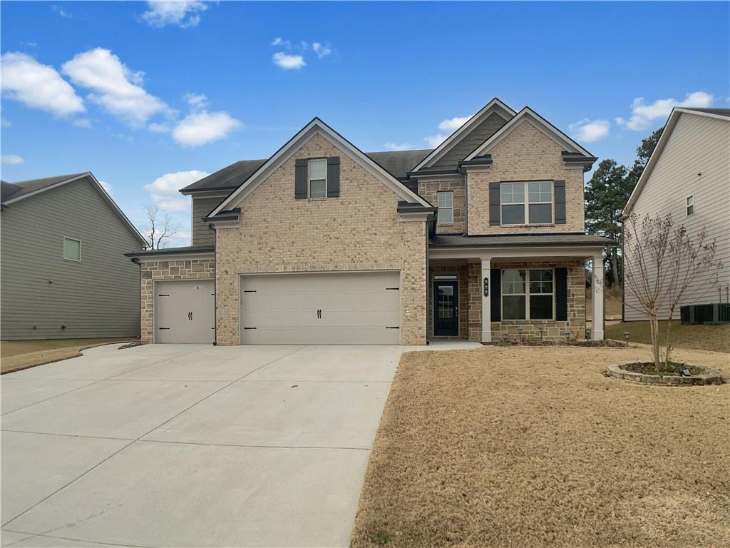 908 West Union Grove Circle Auburn, GA 30011 - Photo 7 of 16 a front view of a house with a yard