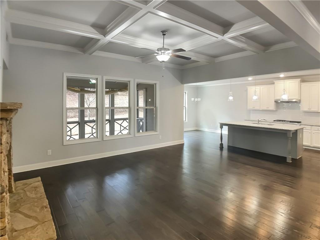 908 West Union Grove Circle Auburn, GA 30011 - Photo 8 of 16 a view of an empty room with wooden floor and a window