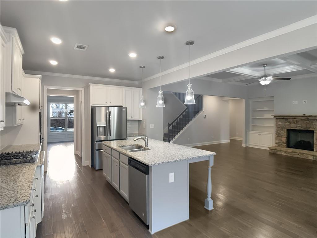 908 West Union Grove Circle Auburn, GA 30011 - Photo 9 of 16 a kitchen with stainless steel appliances granite countertop a stove and a refrigerator